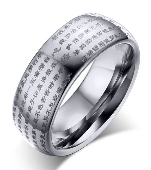 Silver ring with engraved text on a white background