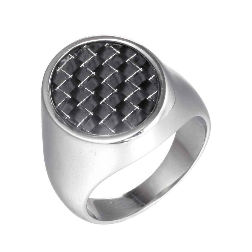 Silver ring with a black woven center on a white background