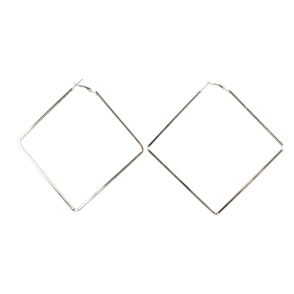 Pair of silver hoop earrings on a white background