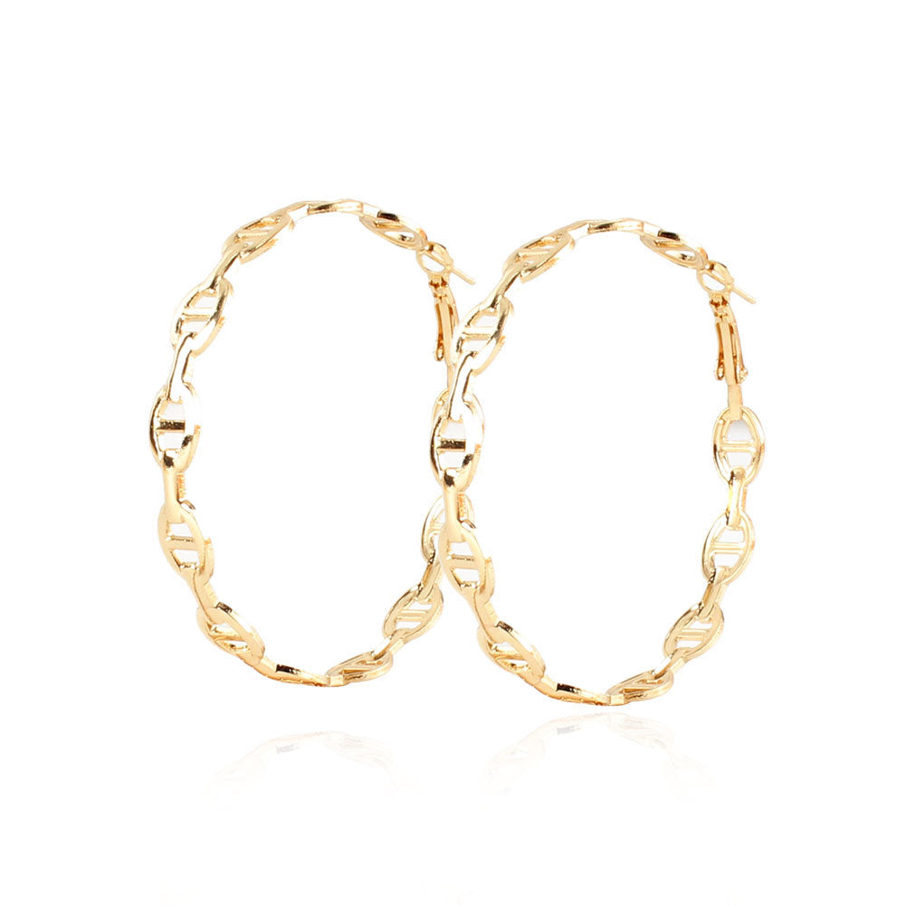 Gold hoop earrings on a white background