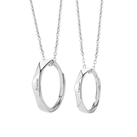 Two silver necklaces with pendant pendants on a white background
