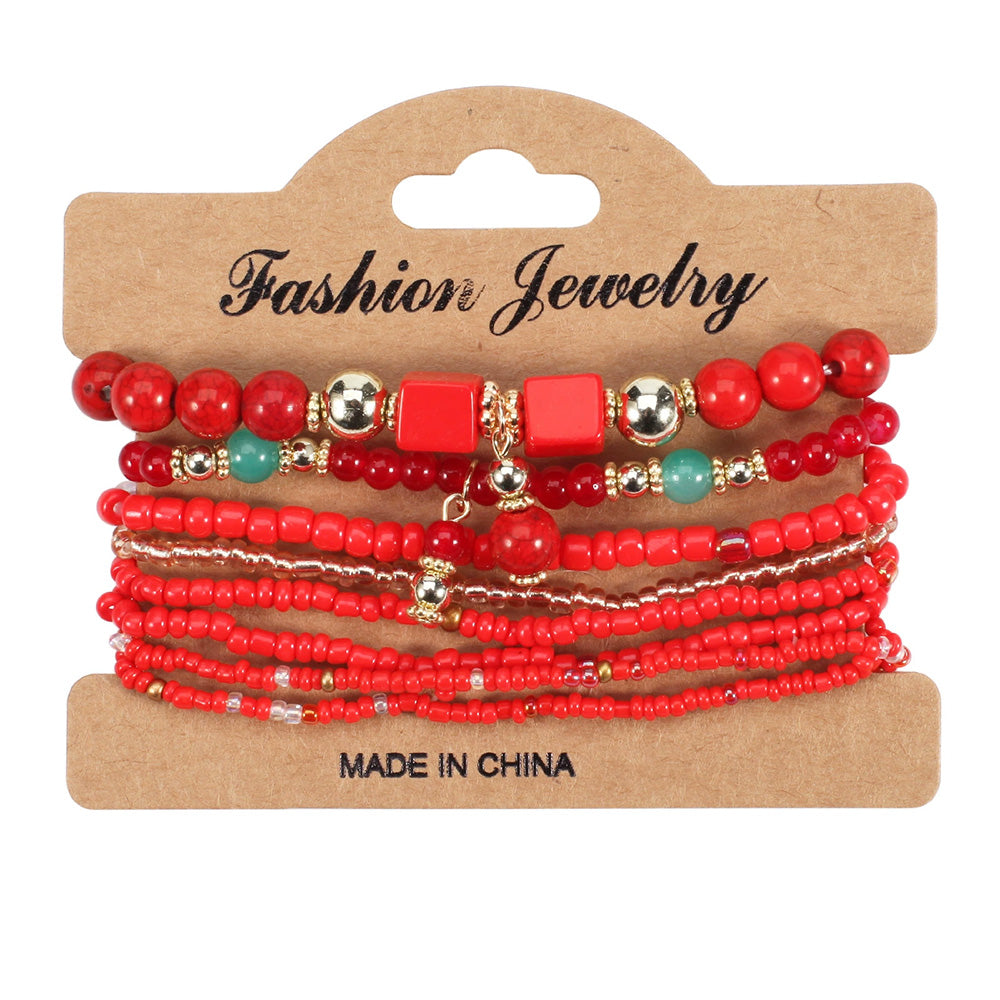 Set of red beaded bracelets on a 'Fashion Jewelry' card with 'Made in China' text.