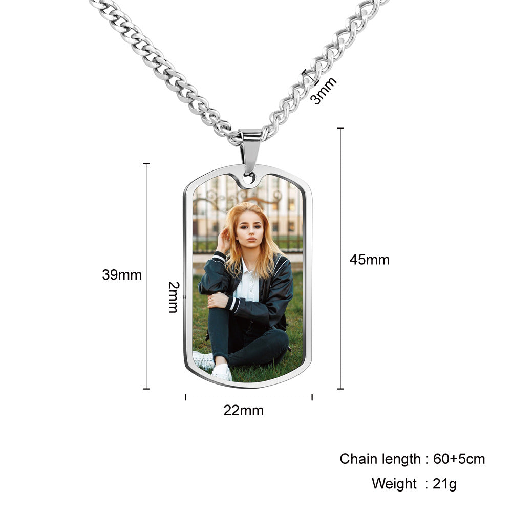 Silver dog tag necklace with a custom photo insert, showing dimensions (39mm x 22mm x 45mm), chain length 60+5cm, and weight 21g on a white background.
