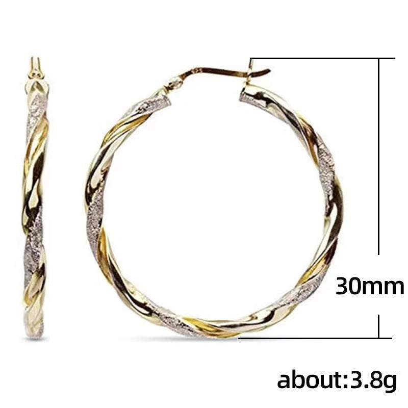 Gold hoop earrings with measurements on a white background