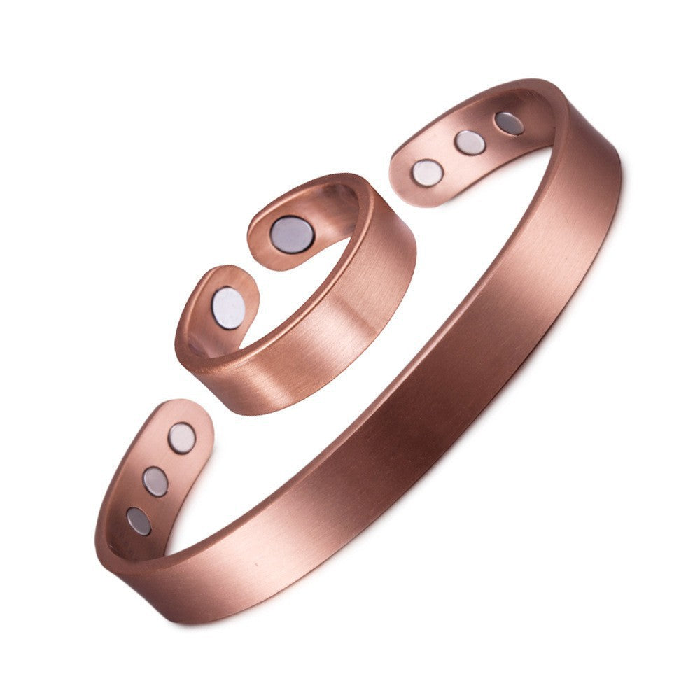 Rose gold bracelet with magnetic stones on a white background