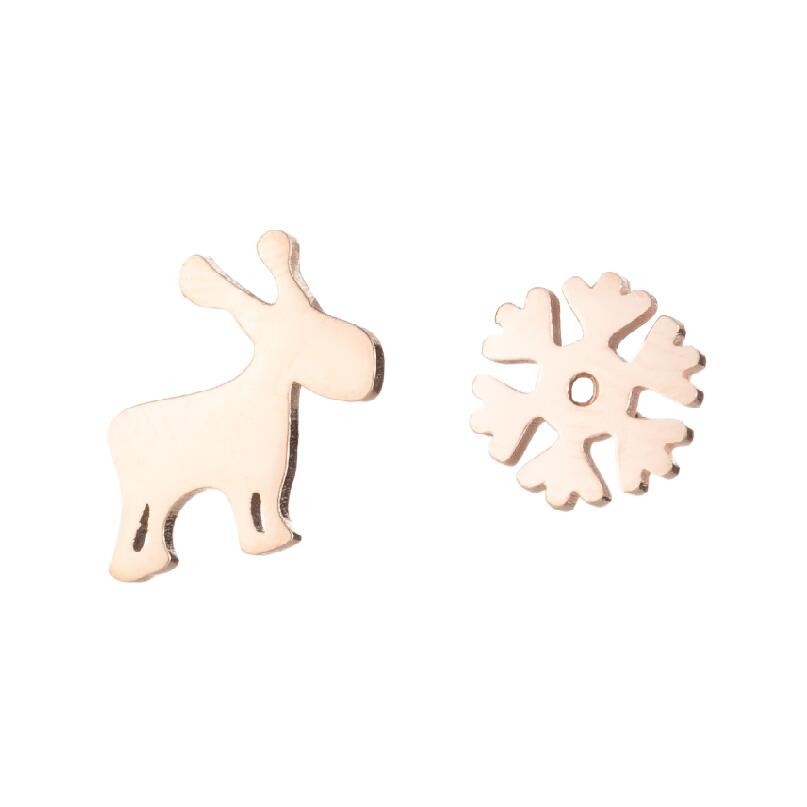 Wooden reindeer and snowflake ornament on a white background