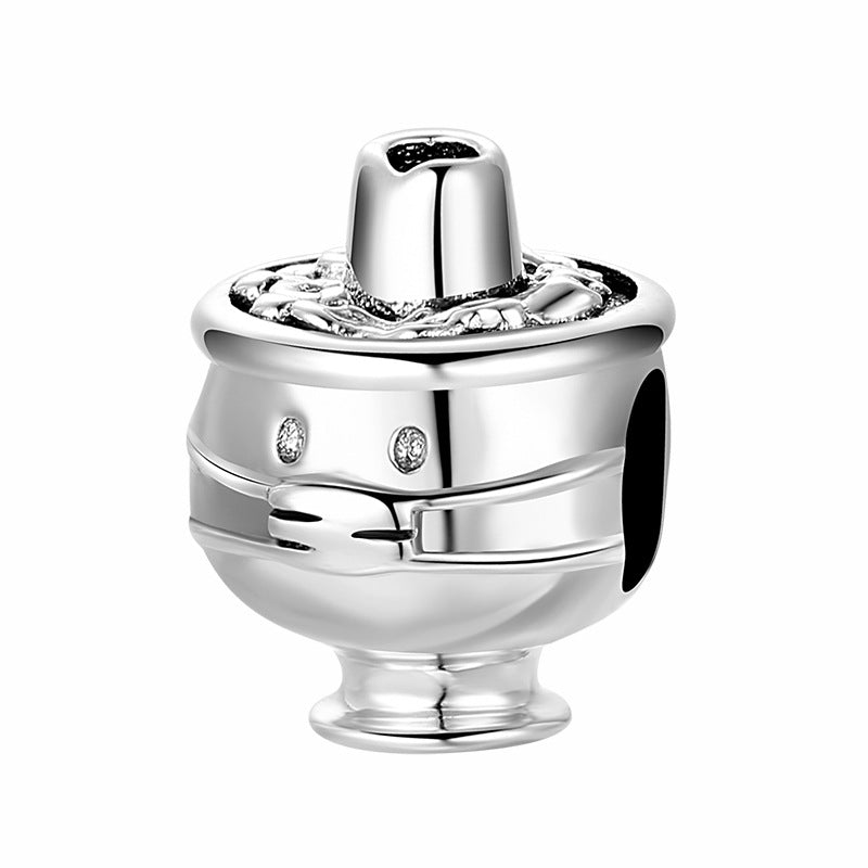 Silver charm with a white background