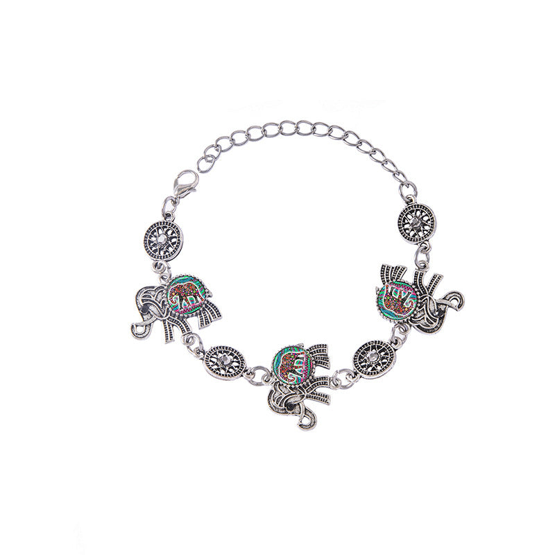 Bracelet with elephant charms on a white background
