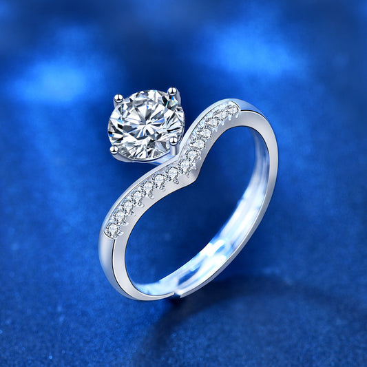 Silver ring with a diamond on a blue background
