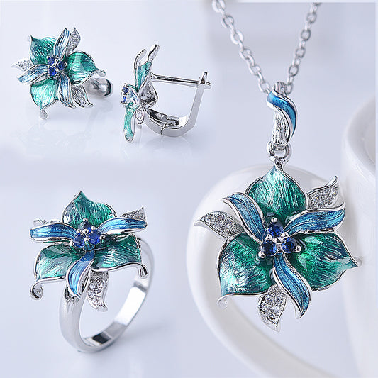 Jewelry set with floral designs on a white background