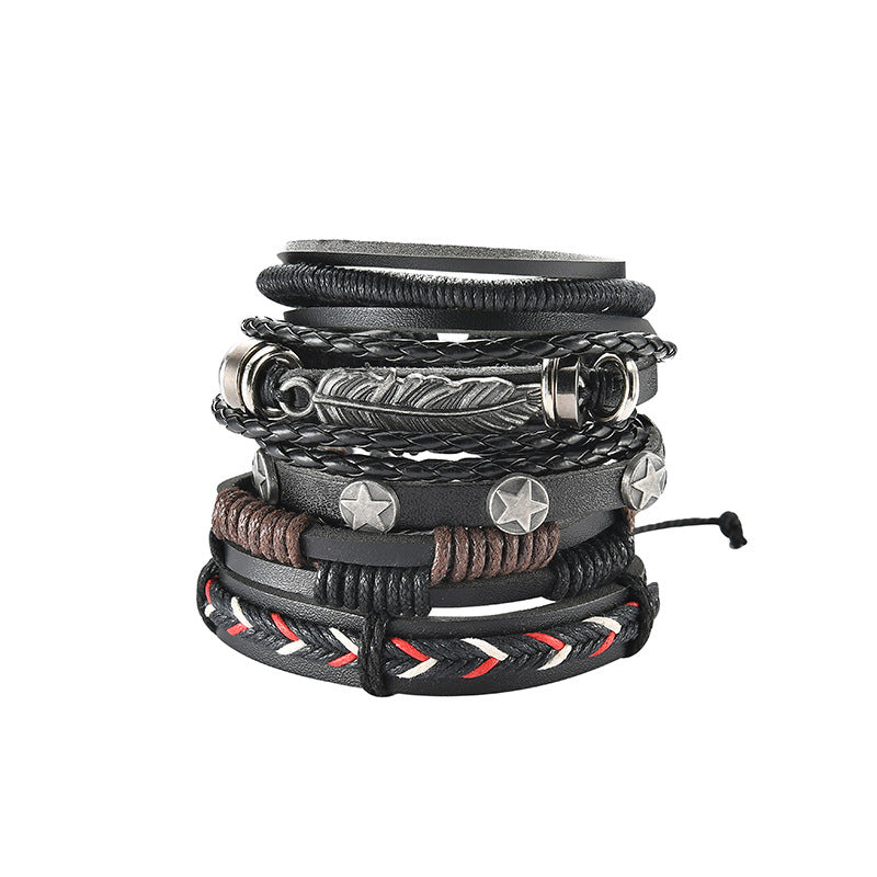 Stack of leather bracelets with metal accents on a white background