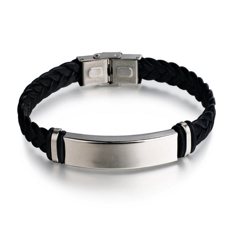Black braided bracelet with a silver clasp and tag on a white background
