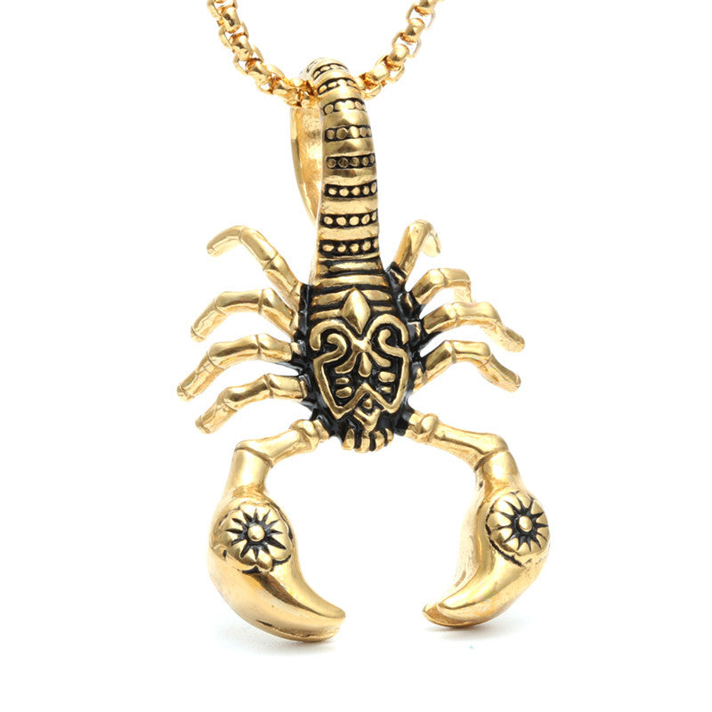 Gold scorpion pendant necklace on a white background