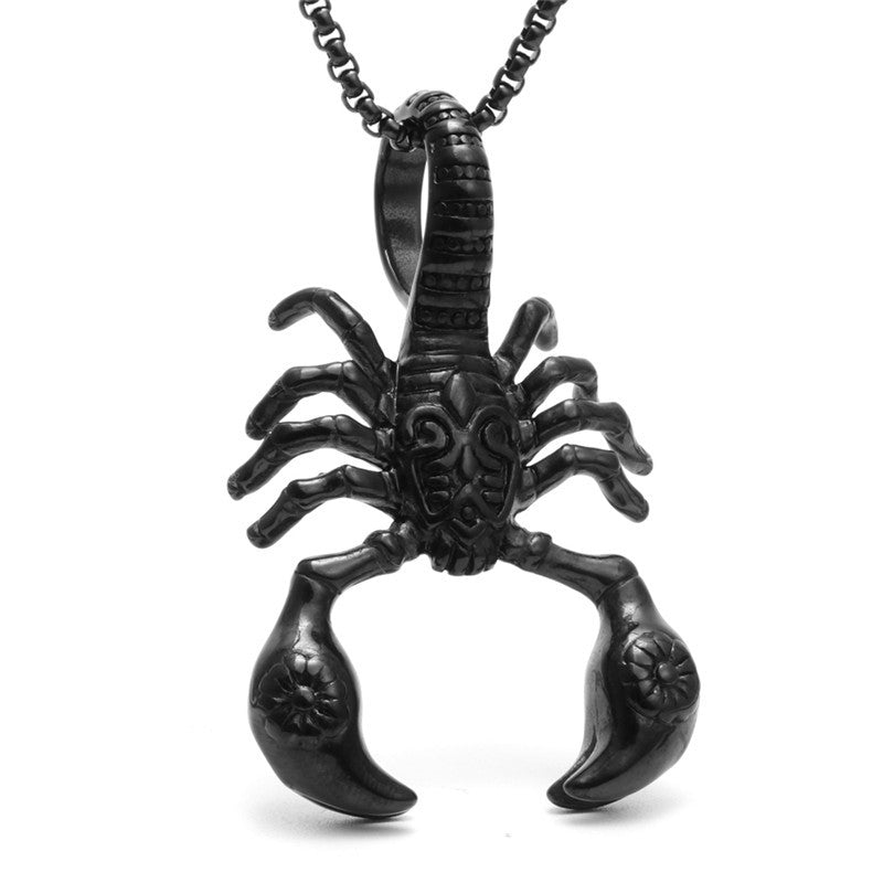 Black scorpion pendant on a chain against a white background