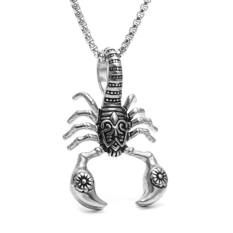 Silver scorpion pendant on a chain against a white background