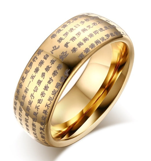 Gold ring with engraved text on a white background