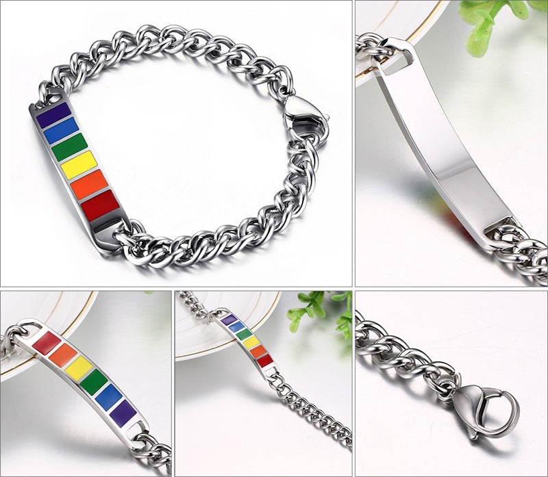 Silver chain bracelet with a colorful square charm on a white background