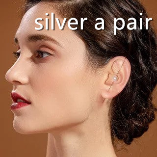 Woman wearing a silver earring with text 'silver a pair' on a brown background