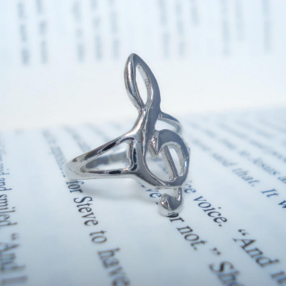 Silver ring with a unique design on an open book