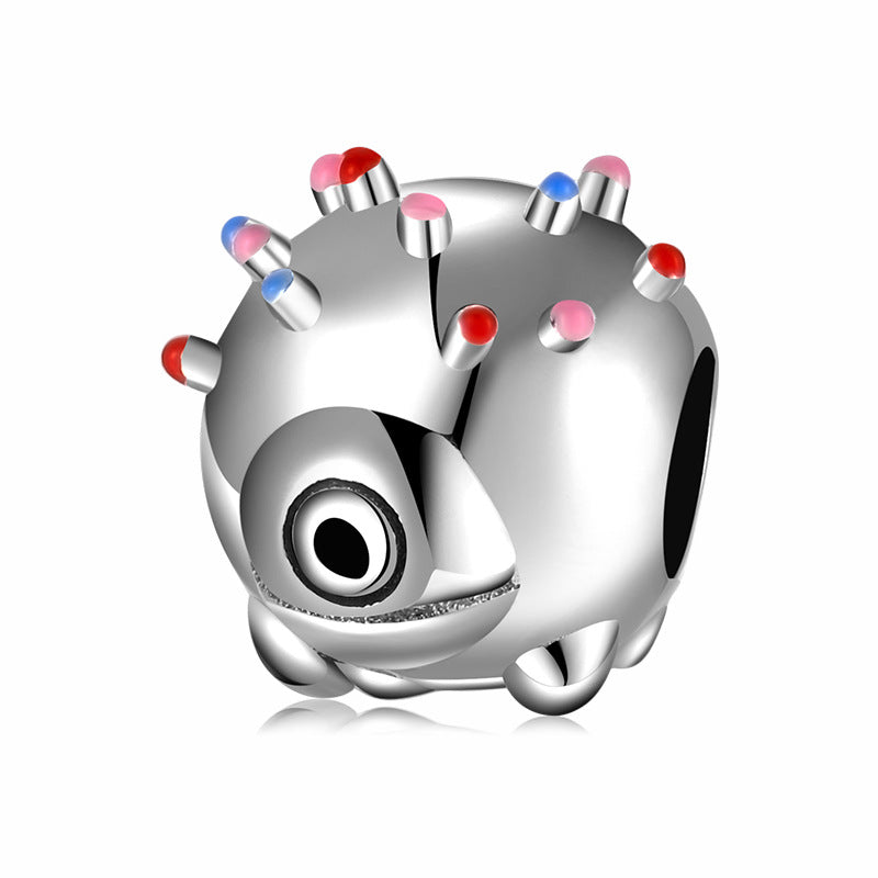 Silver charm with colorful accents on a white background