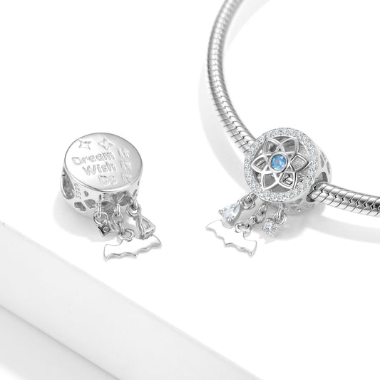 Silver charm bracelet with two charms on a white background