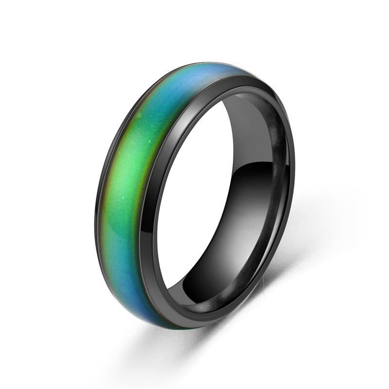 Ring with black exterior and gradient green to blue interior on a white background