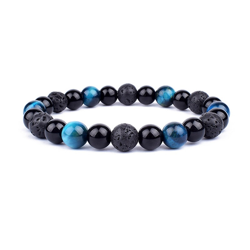 Beaded bracelet with black and blue stones on a white background