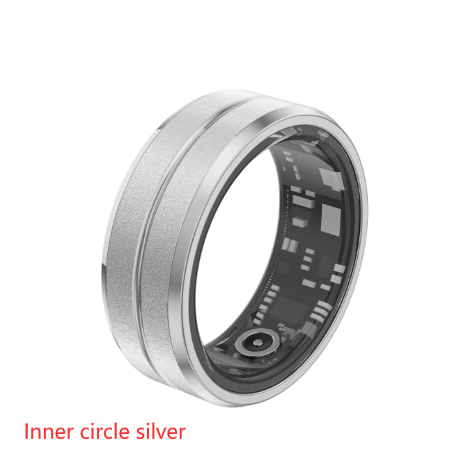 Silver electronic ring with visible circuitry on a white background