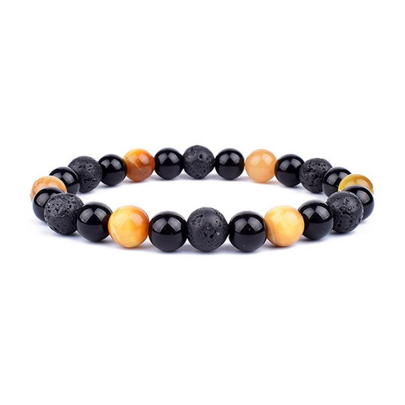 Black and orange beaded bracelet on a white background