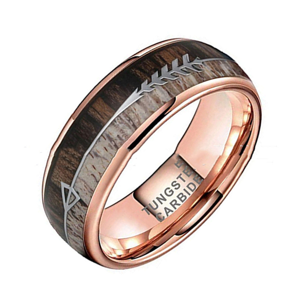 Rose gold ring with wood inlay on a white background