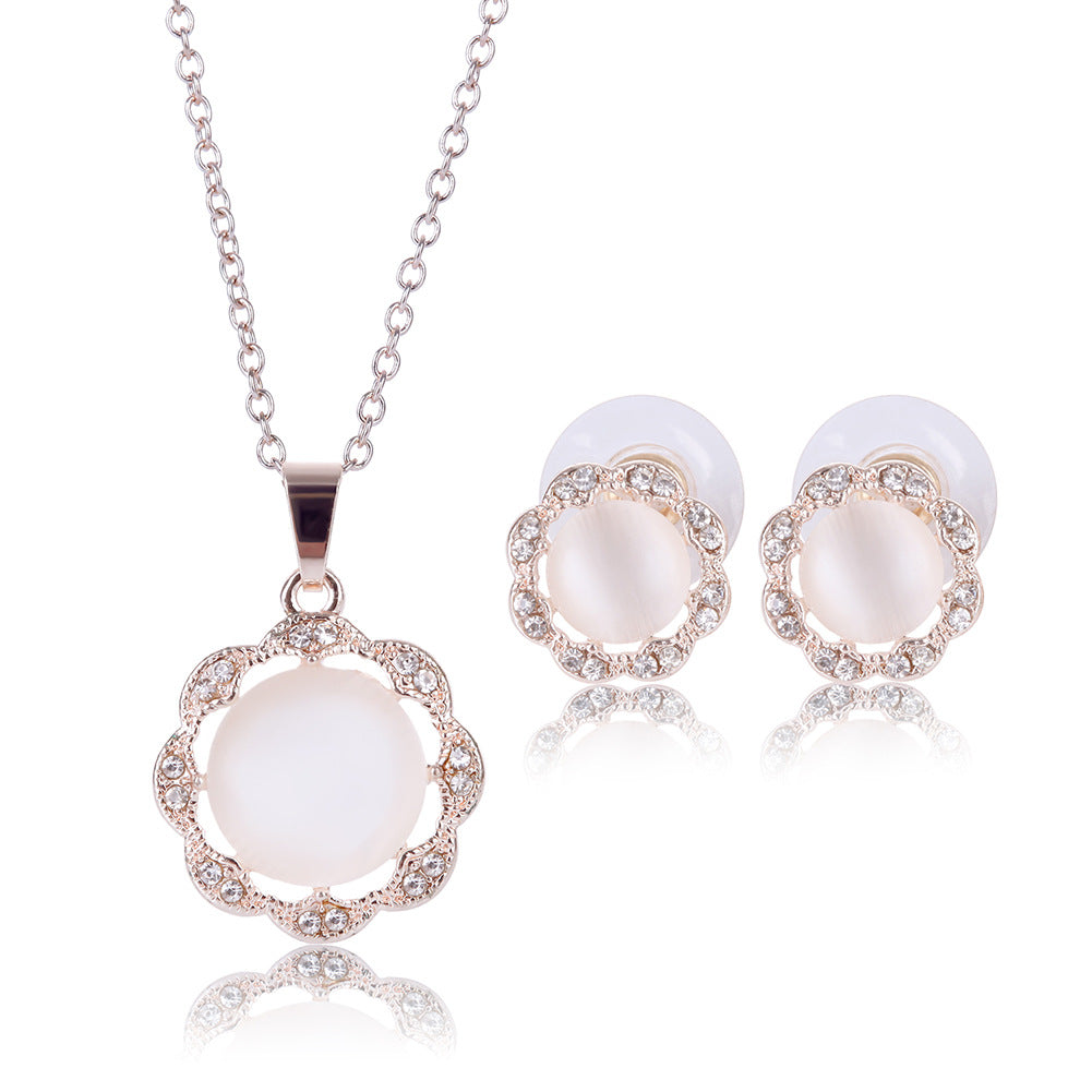 Jewelry set with pendant and earrings on a white background