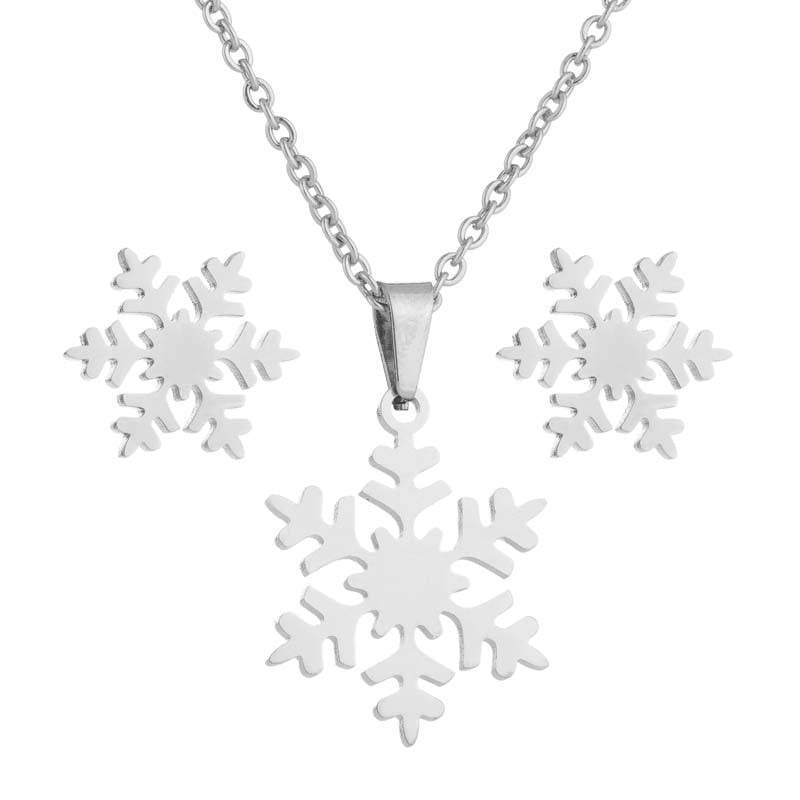 Silver snowflake pendant necklace on a white background
