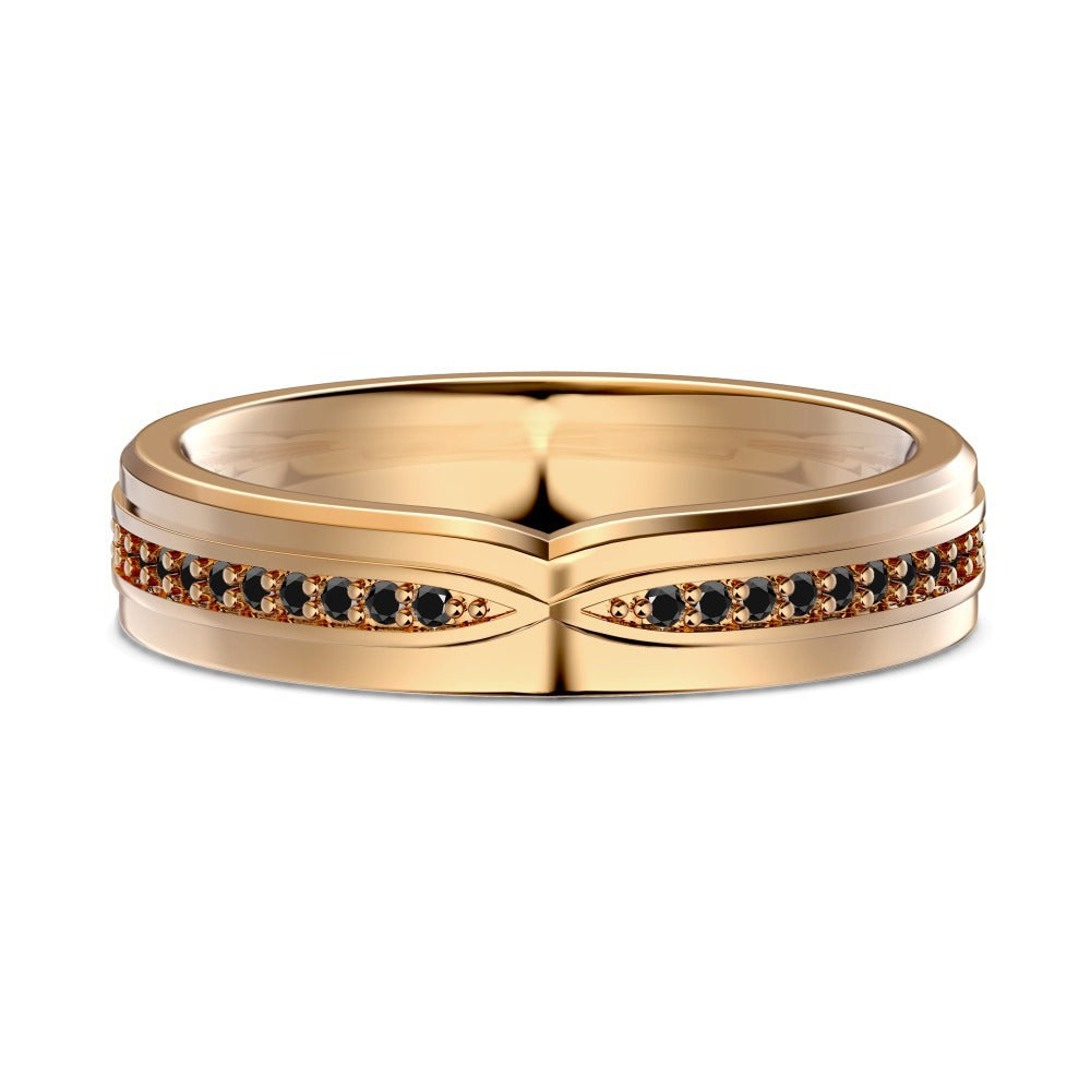 Gold ring with black gemstones on a white background