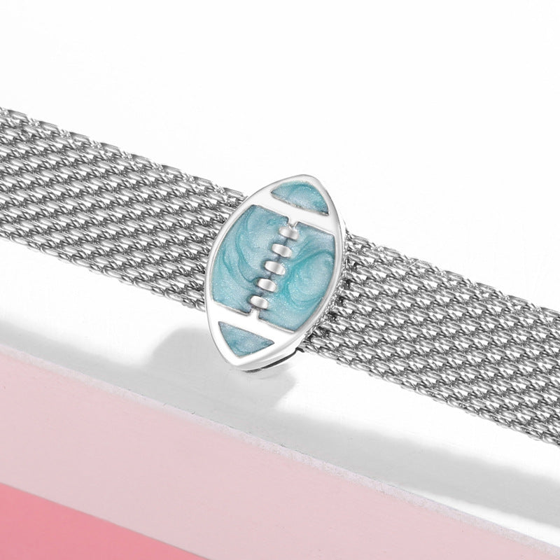 Silver bracelet with a blue football-shaped clasp on a white background