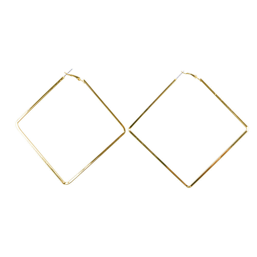 Gold hoop earrings on a white background