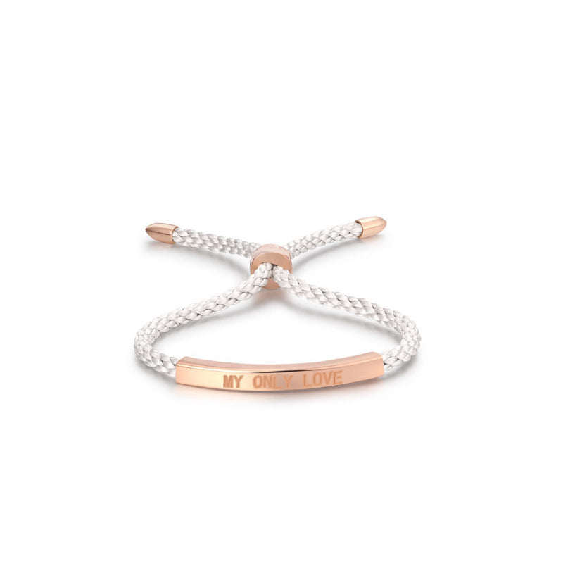 Braided bracelet with rose gold clasp and 'My Only Love' engraving on a white background