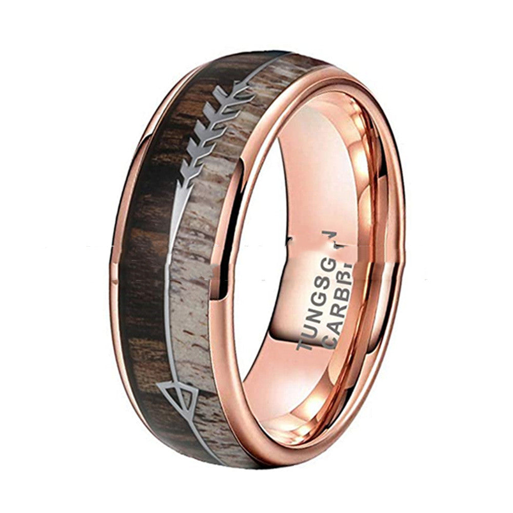 Rose gold ring with wooden inlay on a white background