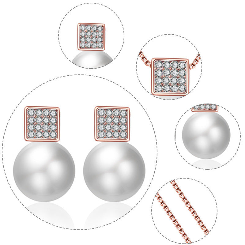 Jewelry set with pearl earrings, square stud earrings, and chain on a white background