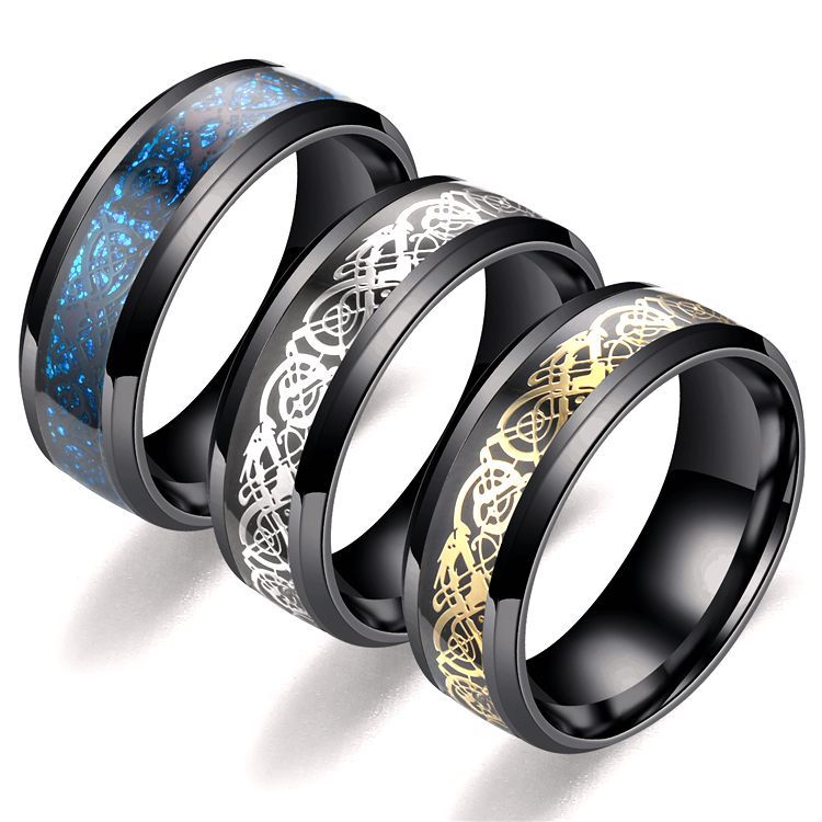Three black-rimmed rings with blue, white, and gold dragon designs on a white background