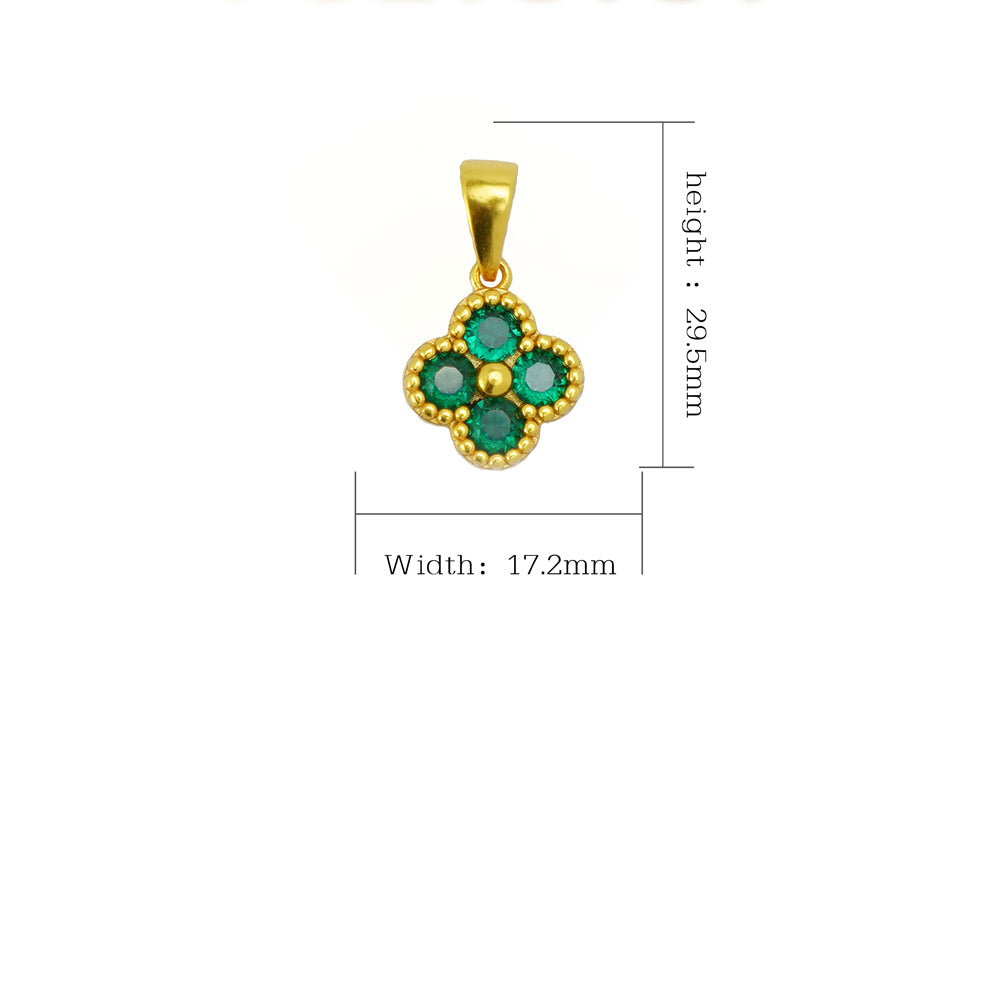 Gold pendant with green gemstones and measurements on a white background