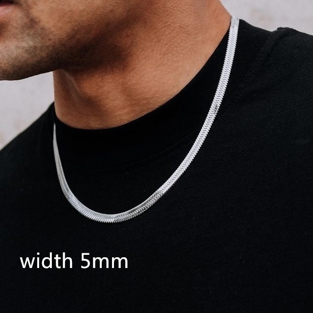 Silver chain necklace worn by a person on a black shirt with 'width 5mm' text.
