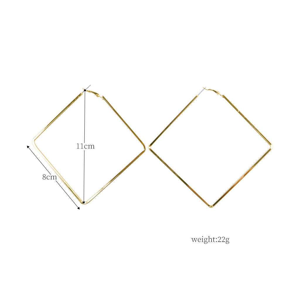 Gold hoop earrings with measurements on a white background