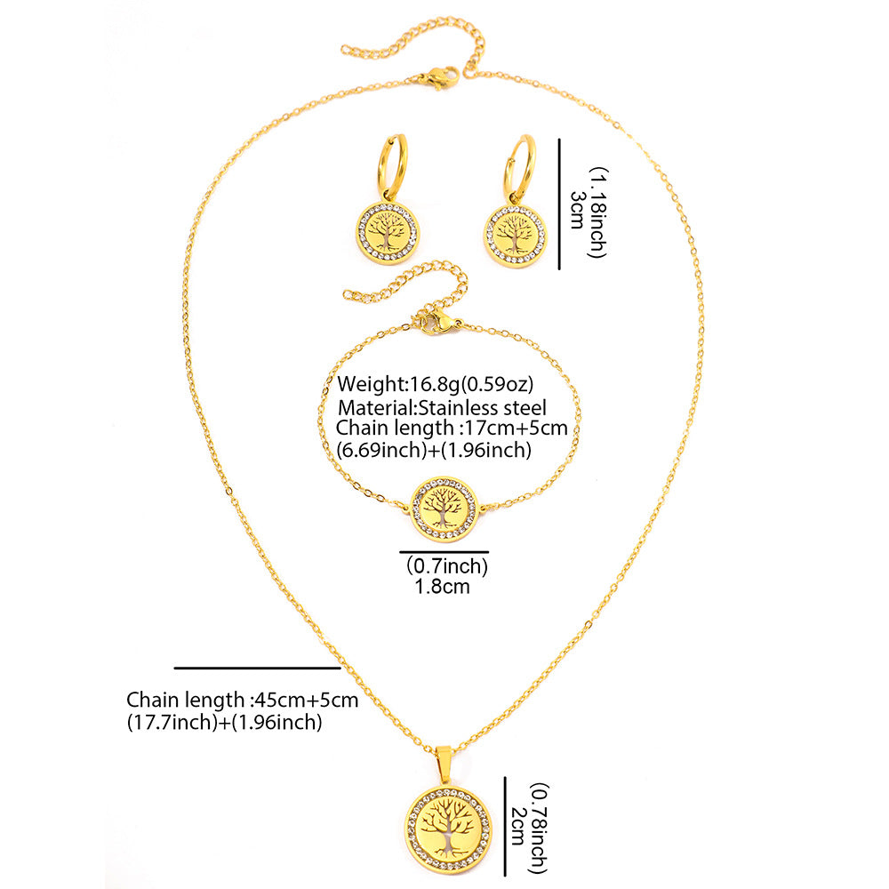 Gold jewelry set with necklace, earrings, and pendant on a white background
