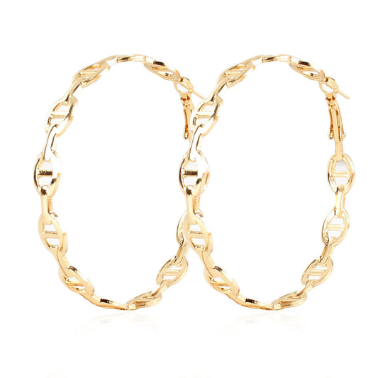Gold hoop earrings on a white background