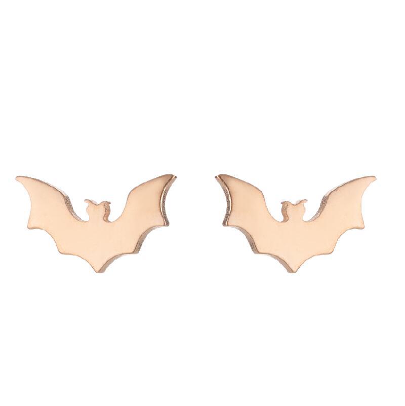 Rose gold bat-shaped earrings on a white background