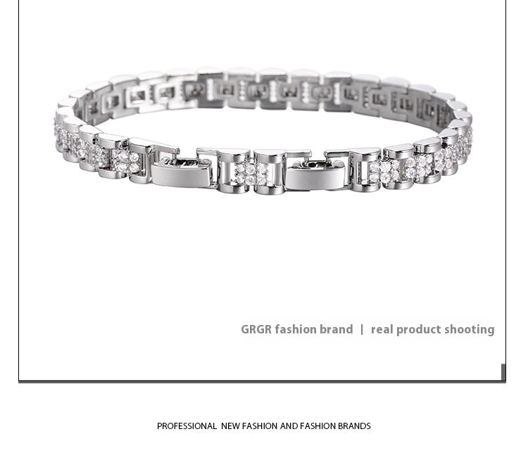 Silver bracelet with clear stones on a white background