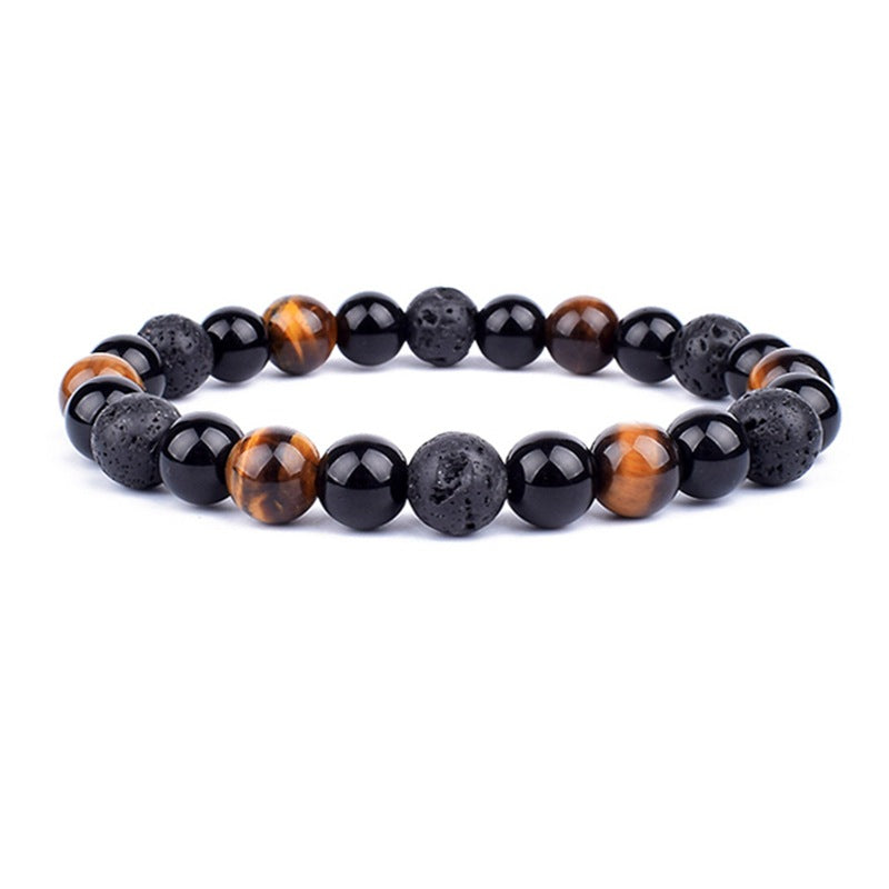 Beaded bracelet with black, brown, and gray stones on a white background