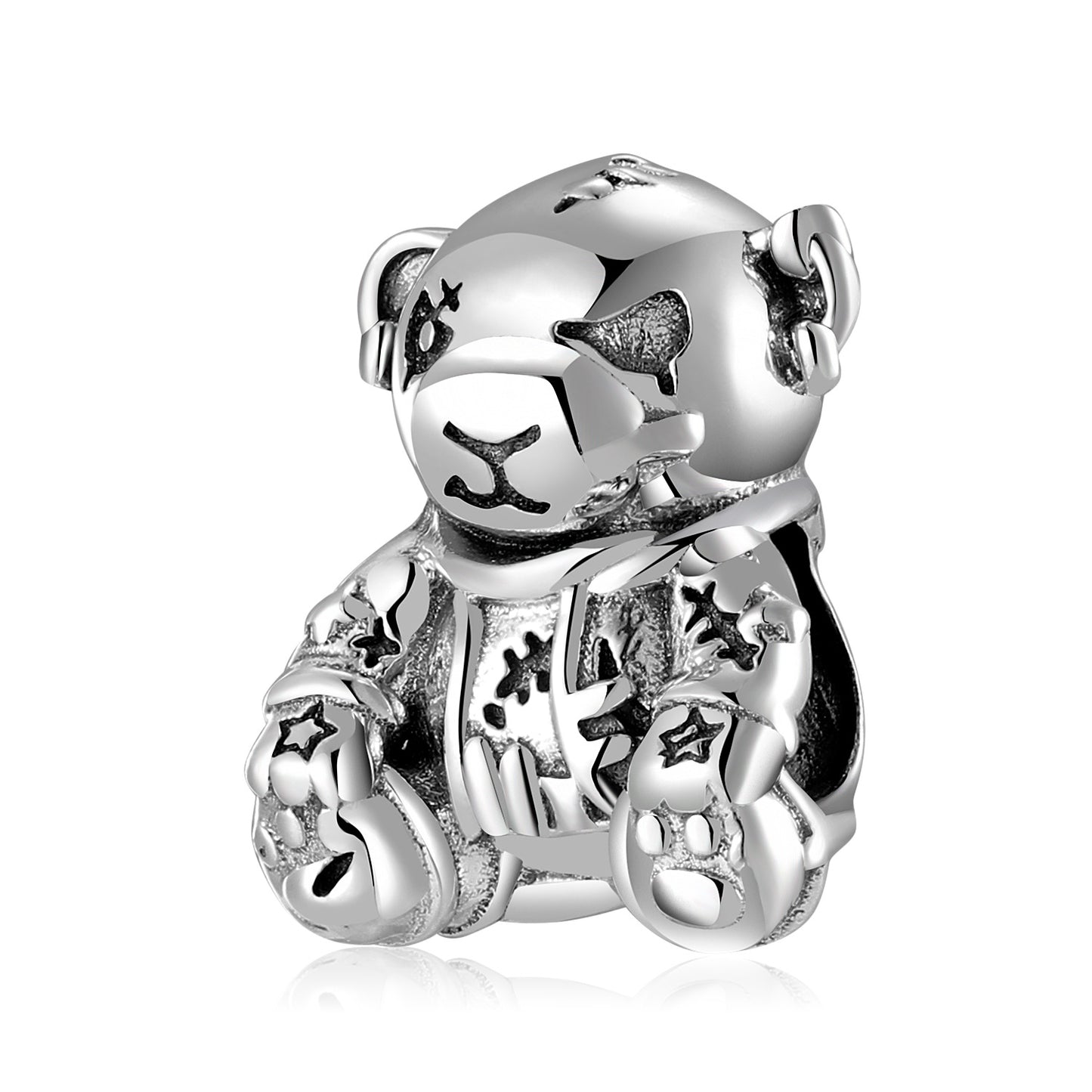 Silver teddy bear charm with star designs on a white background