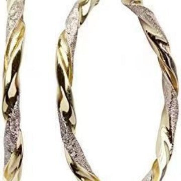 Gold and silver hoop earrings on a white background