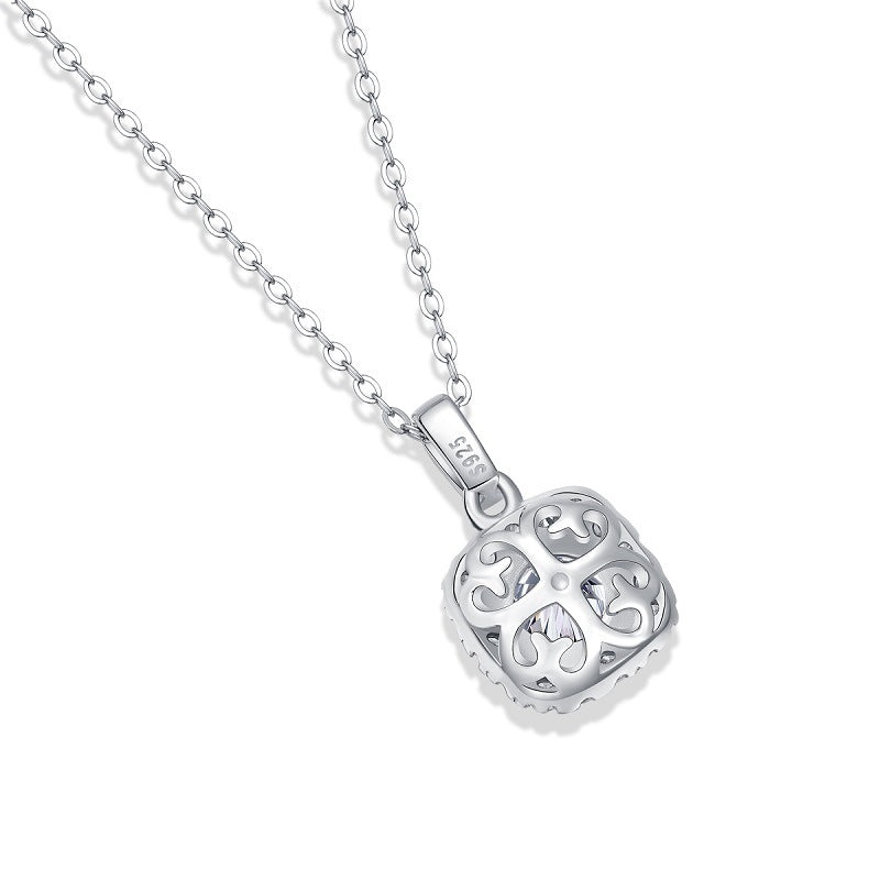 Silver necklace with a heart-shaped pendant on a white background